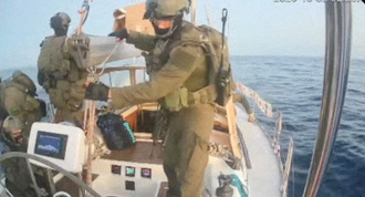 Gaza-bound vessel Oxygono, part of the Global Sumud Flotilla, as they are intercepted by people in uniform